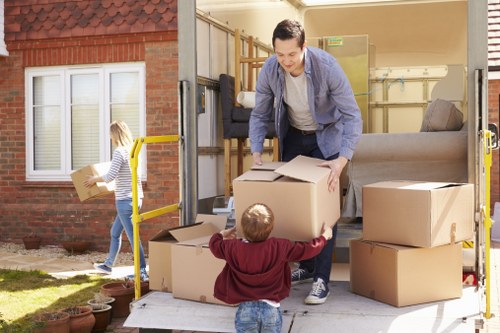 Removal team arranging items for recycling in Liverpool home