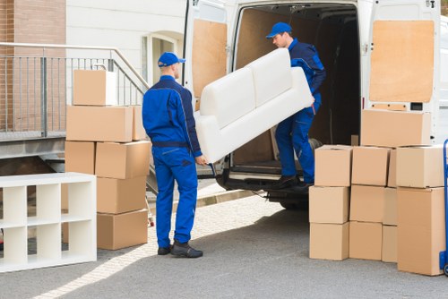 Man with van helping to load furniture for a move in Liverpool
